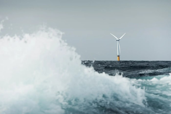 Floating offshore wind turbine on the horizon with large wave in the foreground-__ Equinor.jpg